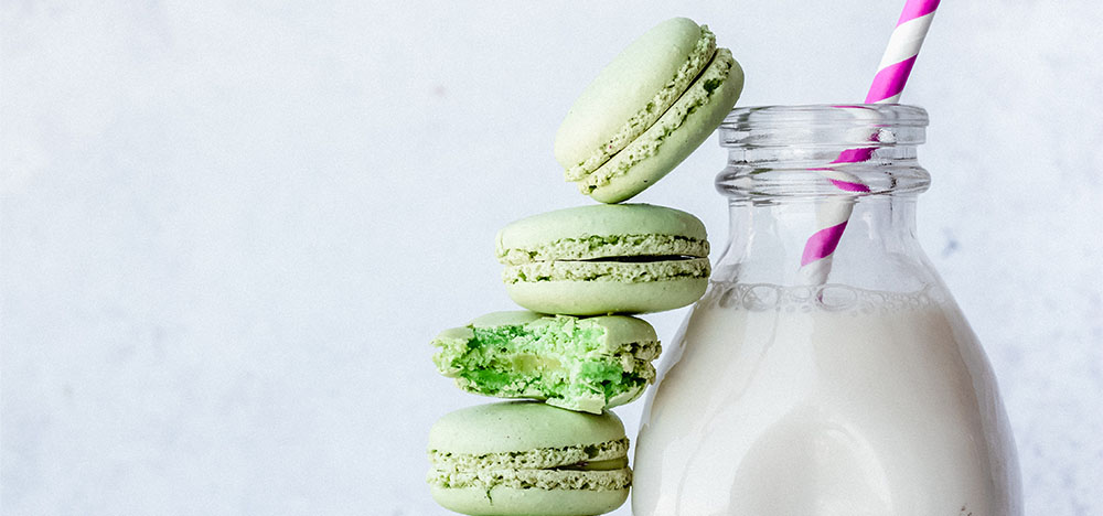 Neo Mint Macaroon in stack with oat milk coffee